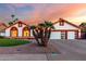 Charming single-Gathering home featuring a three-car garage, well-maintained lawn, and desert landscaping at 3037 E Mallory St, Mesa, AZ 85213