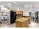 Open kitchen featuring a center island, modern appliances, granite counters and stainless steel fixtures at 3037 E Mallory St, Mesa, AZ 85213