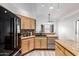 Well-equipped kitchen includes stainless steel appliances, sleek countertops, and modern cabinetry at 3037 E Mallory St, Mesa, AZ 85213