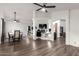 Open-concept living space with modern flooring, ceiling fans, and a dedicated work or gaming area at 3037 E Mallory St, Mesa, AZ 85213