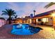 Beautiful swimming pool, BBQ and outdoor seating area at dusk at 3037 E Mallory St, Mesa, AZ 85213