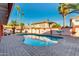 Stunning backyard with a sparkling pool and tropical landscaping provides a private oasis for relaxation at 3037 E Mallory St, Mesa, AZ 85213