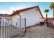 Backyard view showcasing a secure fenced area and low-maintenance landscaping, providing practicality and security at 3037 E Mallory St, Mesa, AZ 85213
