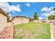 A cozy backyard features a lush lawn, a covered patio, and well-maintained landscaping at 3124 W Port Royale Ln, Phoenix, AZ 85053