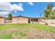 The backyard is spacious, featuring a well-kept lawn and a covered patio, great for relaxing at 3124 W Port Royale Ln, Phoenix, AZ 85053