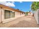 Gravel-filled backyard with a patio and detached building at 3124 W Port Royale Ln, Phoenix, AZ 85053