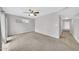 Cozy bedroom featuring neutral carpet, ceiling fan, and natural light at 3124 W Port Royale Ln, Phoenix, AZ 85053