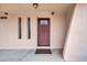 Close up of the front door with decorative glass and sidelight windows at 3124 W Port Royale Ln, Phoenix, AZ 85053