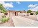 Charming single-story home with desert landscaping and a long driveway at 3124 W Port Royale Ln, Phoenix, AZ 85053