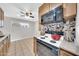 Kitchen featuring white appliances, breakfast bar, and tile flooring at 3124 W Port Royale Ln, Phoenix, AZ 85053