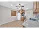 Bright kitchen with oak cabinets, tile flooring, and a modern countertop at 3124 W Port Royale Ln, Phoenix, AZ 85053