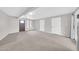 Large living area featuring new carpet, modern paint, and two entry doors at 3124 W Port Royale Ln, Phoenix, AZ 85053