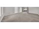Another view of the spacious living room with carpet and bright paint at 3124 W Port Royale Ln, Phoenix, AZ 85053