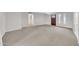Spacious living room with neutral carpet and ample natural light at 3124 W Port Royale Ln, Phoenix, AZ 85053