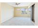 Bedroom includes a ceiling fan, mirrored closet, window and neutral carpet at 3500 N Hayden Rd # 206, Scottsdale, AZ 85251