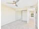 Bedroom with fan and closet mirror at 3500 N Hayden Rd # 206, Scottsdale, AZ 85251