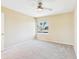 Bedroom with large window, neutral walls, and carpet at 3500 N Hayden Rd # 206, Scottsdale, AZ 85251