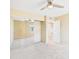 Bedroom featuring mirrored closet doors, fan, and neutral walls at 3500 N Hayden Rd # 206, Scottsdale, AZ 85251