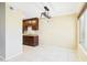 Well-lit dining area with modern lighting, tile floors, and kitchen access at 3500 N Hayden Rd # 206, Scottsdale, AZ 85251