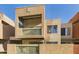 Unique two-story exterior featuring a balcony with decorative latticework and a tan stucco finish at 3500 N Hayden Rd # 206, Scottsdale, AZ 85251