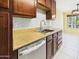 Updated kitchen features stainless steel appliances, granite countertops, and ample cabinet space at 3500 N Hayden Rd # 206, Scottsdale, AZ 85251