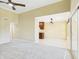 Living room with neutral carpet, flows into the dining area and has sliding glass door to patio at 3500 N Hayden Rd # 206, Scottsdale, AZ 85251