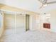 Spacious main bedroom with neutral carpet, closet, ceiling fan, and attached bathroom at 3500 N Hayden Rd # 206, Scottsdale, AZ 85251