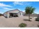 A low maintenance backyard with a covered patio and privacy fencing at 35585 W San Alvarez Ave, Maricopa, AZ 85138