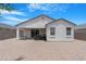 A low maintenance backyard with a covered patio and privacy fencing at 35585 W San Alvarez Ave, Maricopa, AZ 85138