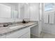 Bathroom featuring a stylish sink area with granite counters and modern fixtures at 35585 W San Alvarez Ave, Maricopa, AZ 85138