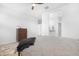 Minimalist bedroom showcasing carpet, a ceiling fan, and an ensuite bathroom at 35585 W San Alvarez Ave, Maricopa, AZ 85138