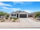 Beautiful single-story home with desert landscaping, a two-car garage, and a neutral color scheme at 35585 W San Alvarez Ave, Maricopa, AZ 85138