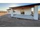Inviting back patio area with a wooden beam roof and views of the desert landscape at 3627 W Palmaire Ave, Phoenix, AZ 85051