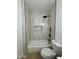 Contemporary bathroom featuring a tiled shower-tub, with sleek black fixtures at 3627 W Palmaire Ave, Phoenix, AZ 85051