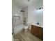 Stylish bathroom with tiled shower-tub, modern vanity, and neutral decor at 3627 W Palmaire Ave, Phoenix, AZ 85051