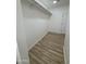 Walk-in closet with wood-look flooring and custom shelving offers ample storage at 3627 W Palmaire Ave, Phoenix, AZ 85051