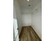 Walk-in closet with wood-look flooring and custom shelving offers ample storage at 3627 W Palmaire Ave, Phoenix, AZ 85051