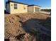 Exterior view of a modern home with stucco, a spacious three-car garage, and desert landscaping at 3627 W Palmaire Ave, Phoenix, AZ 85051
