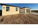 Exterior view of a new construction home featuring an attached garage and desert landscaping at 3627 W Palmaire Ave, Phoenix, AZ 85051