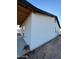 Side view of a modern home with a clean white exterior under a clear blue sky at 3627 W Palmaire Ave, Phoenix, AZ 85051