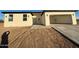 Modern home with stucco exterior, a spacious three-car garage, and desert landscaping at 3627 W Palmaire Ave, Phoenix, AZ 85051