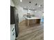 Bright kitchen features a large island, stainless steel appliances, and modern pendant lighting at 3627 W Palmaire Ave, Phoenix, AZ 85051