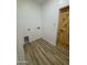 Convenient laundry room with wood-look floors and a barn door at 3627 W Palmaire Ave, Phoenix, AZ 85051
