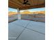 Covered patio with concrete flooring offering outdoor living space and desert views at 3627 W Palmaire Ave, Phoenix, AZ 85051