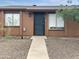 Charming home featuring a secured front door, rock landscaping and cozy covered entrance at 3646 N 67Th Ave # 64, Phoenix, AZ 85033