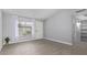 Spacious living room with tile flooring, bright natural light, and neutral paint at 3646 N 67Th Ave # 64, Phoenix, AZ 85033