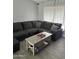 Cozy living room features a large sectional couch, accent pillows, and a coffee table at 3646 N 67Th Ave # 64, Phoenix, AZ 85033