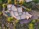 Aerial view of luxury property featuring a pool, covered patio, and lush landscaping at 40858 N 109Th Pl, Scottsdale, AZ 85262