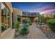 Beautiful exterior featuring desert landscaping, a brick walkway, and a unique architectural design at 40858 N 109Th Pl, Scottsdale, AZ 85262
