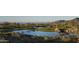 Scenic view of a pristine golf course with a tranquil lake and desert landscape at 40858 N 109Th Pl, Scottsdale, AZ 85262